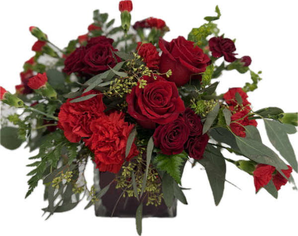 Elegant red floral arrangement with red roses in red cube