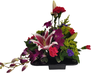 Modern style floral arrangement with brightly colored flowers with a stargazer lily and orchid.