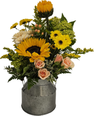 Bouquet of fresh flowers arranged in a 1/2 milk can