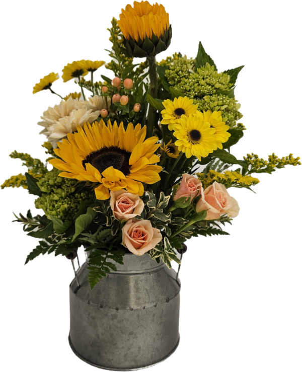 Bouquet of fresh flowers arranged in a 1/2 milk can